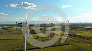 Aerial view of Wind Turbines Farm in Field. Austria. Drone view on Energy Production