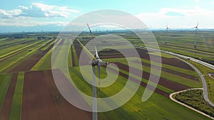 Aerial view of Wind Turbines Farm in Field. Austria. Drone view on Energy Production