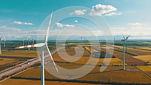 Aerial view of Wind Turbines Farm in Field. Austria. Drone view on Energy Production