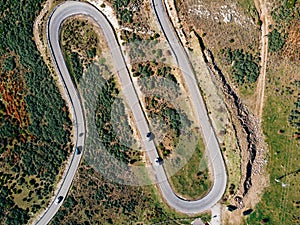 Aerial view of winding road. Highway through the woodland