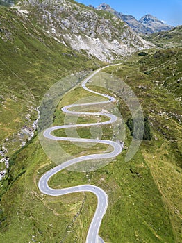 Aerial view of the winding road over the Julier Pass in Swiss Alps mountain photo