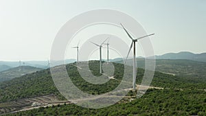 Aerial view windmills that produce electricity in the mountains.