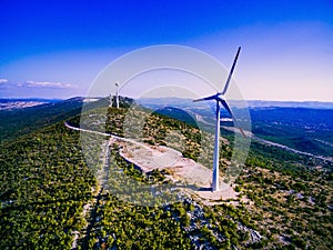 Aerial view of windmills in summer landscape in Croatia. Wind turbines for electric power