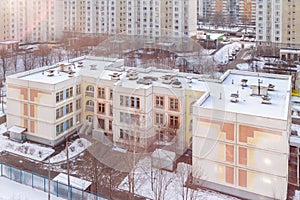 Aerial view winter apartment building exterior mixed-use urban multi-family residential district area development