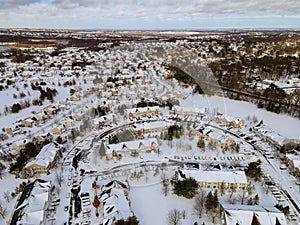 Aerial view winter landscape American town small home complex of a snowy winter on the streets after snowfall
