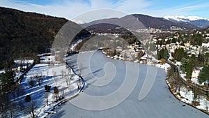 Aerial view of winter landscape of frozen lake Ghirla in province of Varese.