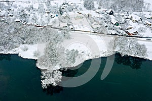 aerial view of winter landscape. village with snow-covered houses and road