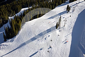 Aerial view winter recreation and sports in Copper Mountain in Colorado with snow fall