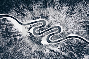 Aerial view of a winter road in the forest