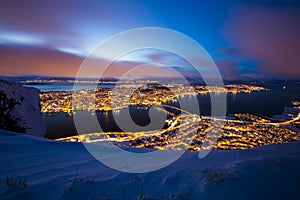 Aerial view of a winter storm approaching the city Tromso, Norway