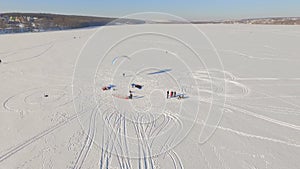 Aerial view. Winter vacation on the frozen lake. horseback riding