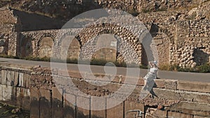 Aerial view of a woman on parapet
