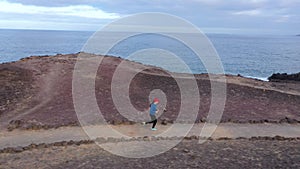 Aerial view of woman runnning along the nature reserve. Healthy active lifestyle