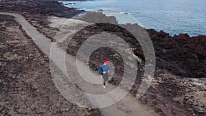 Aerial view of woman runnning along the nature reserve. Healthy active lifestyle