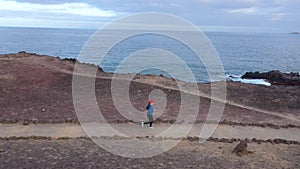 Aerial view of woman runnning along the nature reserve. Healthy active lifestyle. Shot at different speeds - normal and