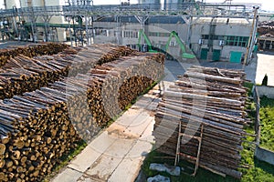 Aerial view of wood processing factory with stacks of lumber at plant manufacturing yard