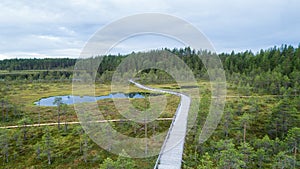 Aerial view of wooden walkway on the territory of Seitseminen National park swamp