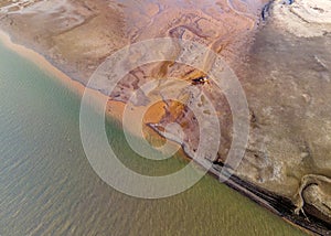 Aerial view of a work site excavating sand on an islet for shell breeding.