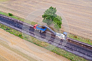 Aerial view on working asphalt scrapping machine