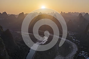 Aerial view of Xingping karsts hills and Li river at sunset near Yangshuo in Guanxi province, China