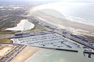 Aerial view of yacht harbor with beach