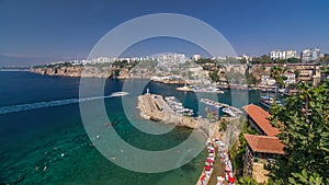 Aerial view of yacht harbor and red house roofs in Old town timelapse Antalya, Turkey.