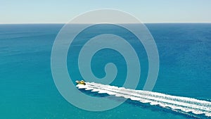 Aerial view Yellow Motor boat sailing in blue sea azure water. Ayia Napa, Cyprus