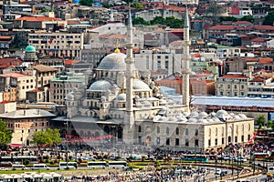 Aerial view of Yeni Cami mosque and Galata bridge during the day in Istanbul, Turkey