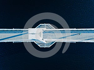 Aerial view of Ylisto footbridge over blue lake in Finland, Jyvaskyla