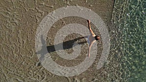 Aerial view of young man swimming in the sea