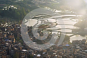 Aerial view of Yuanyang rice terraces filled with water in Yunnan - China, Unesco World Heritage Site