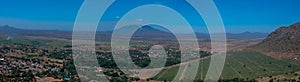 Aerial view of the Zomba Plateau with vineyards and rural neighbourhood with Mount Mulanje in the background