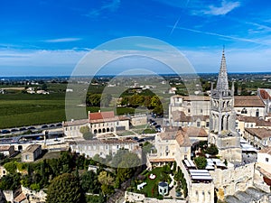 Aerial views of green vineyards, old houses and streets of medieval town St. Emilion, production of red Bordeaux wine on cru class