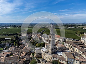 Aerial views of green vineyards, old houses and streets of medieval town St. Emilion, production of red Bordeaux wine on cru class