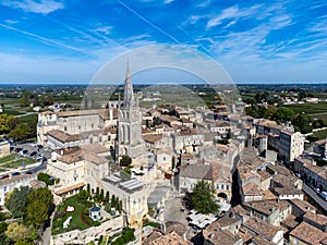 Aerial views of green vineyards, old houses and streets of medieval town St. Emilion, production of red Bordeaux wine on cru class