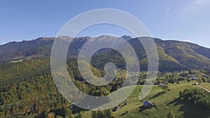 Aerial views of the scenic rural landscape surrounded by Carpathian Mountains, Brasov, Romania