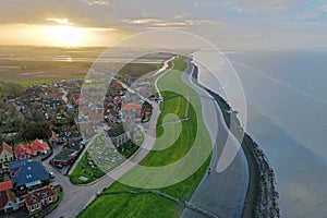 Aerial from the village Wierum in the Netherlands at sunset near the Waddenzee