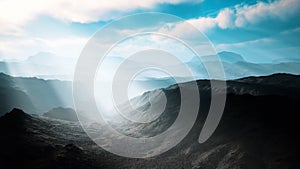 Aerial vulcanic desert landscape with rays of light