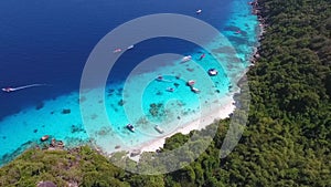 Aerial: White Sandy Beach with Clear Blue Water at Similan Island. HD. Andaman Sea, Thailand.