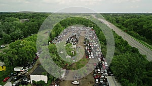 Aerial wide footage abandoned, destroyed cars in junkyard. Car recycling industry