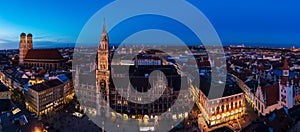 Aerial wide panorama of The New Town Hall and Marienplatz at night, Munich, Germany