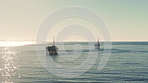 Aerial wide shot of Oil Gas Pacific Ocean drilling Platform Rig on California