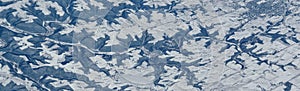 Aerial winter snow landscape view of rural and city land between Minneapolis Minnesota and Indianapolis Indiana with stark contras