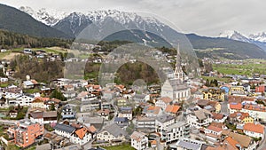 Aerial winter view of the city centre of Imst in Tirol. Beautiful city view Pfarrkirche Imst.