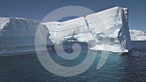 Aerial zoom flight over ocean. Antarctica iceberg.