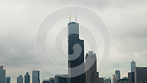 Aerial zoom shot of Chicago on a foggy day. Cloudy day in downtown Chicago Illinois, skyscrapers and business centers of