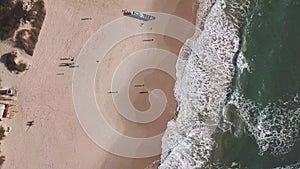 Aerial zoom in spinning shot of tropical beach in southern of Brazil
