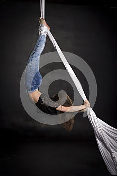 Aerialist doing tricks on silks