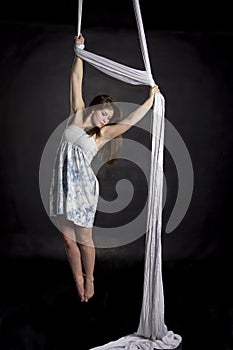 Aerialist doing tricks on silks