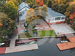 Aerialphoto boat station with pier, bill  boats, kayaks and rowing